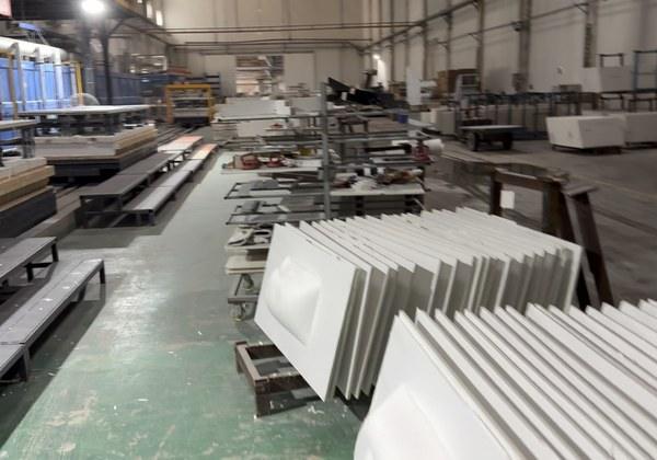 Cut sintered stone blanks stacked on the workshop floor